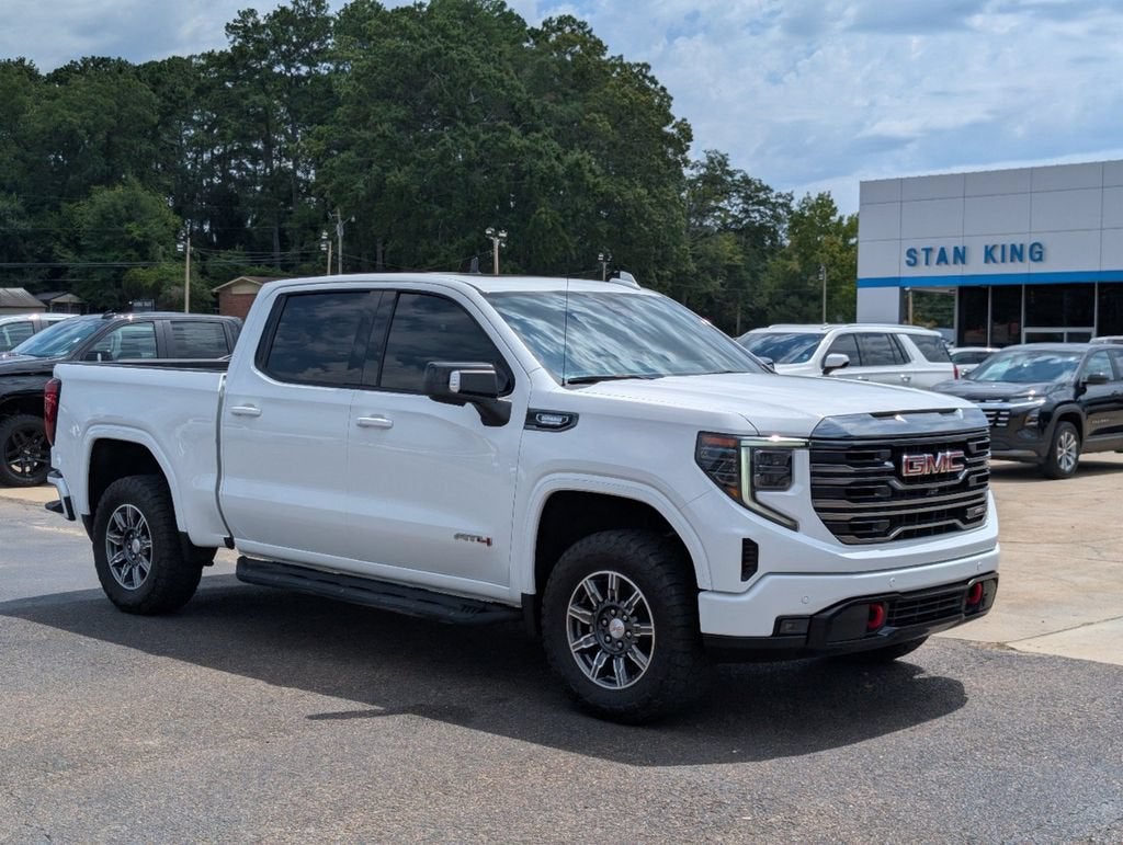 2024 GMC Sierra 1500 AT4 in Summit White — front three-quarter view