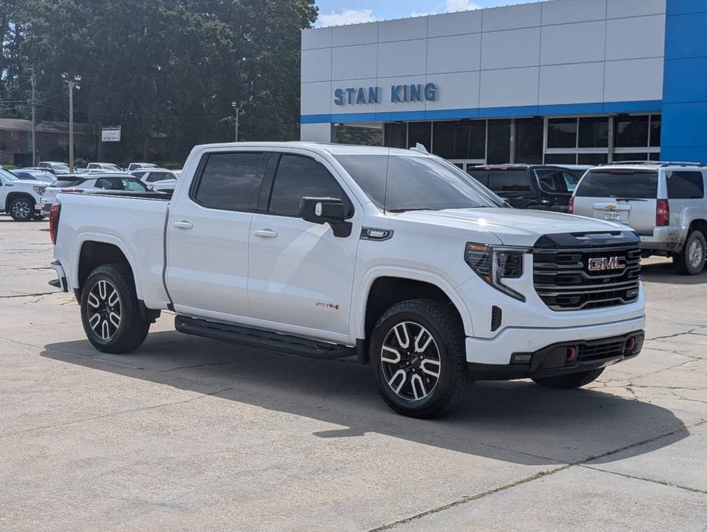 2025 GMC Sierra 1500 AT4 in Summit White — front three-quarter view