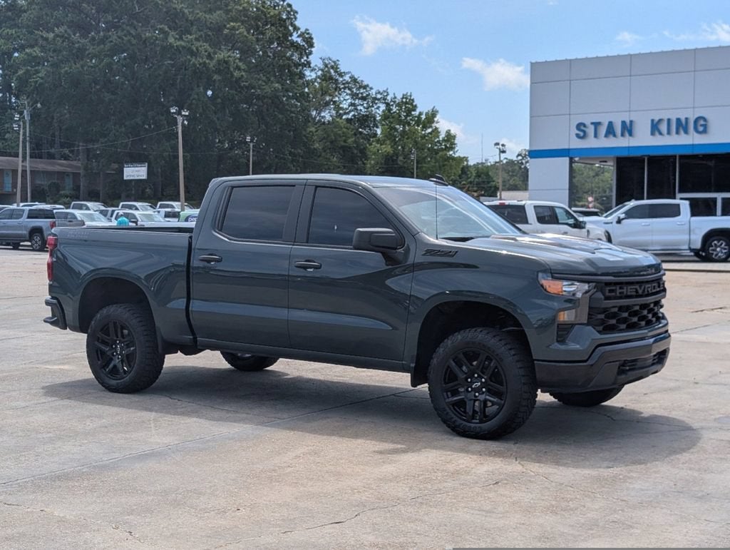 2025 Chevrolet Silverado 1500 Custom Trail Boss in Cypress Gray — front three-quarter view